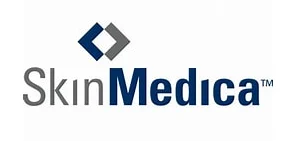 Logo of SkinMedica featuring a dual diamond design above the text. The word Skin is in gray, and Medica is in blue with a trademark symbol.
