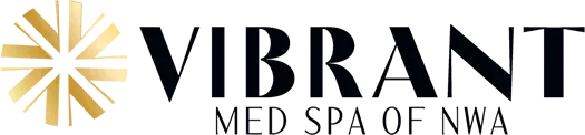 Logo for Vibrant Med Spa of NWA, featuring the word VIBRANT in bold, black letters beside a stylized gold starburst design.